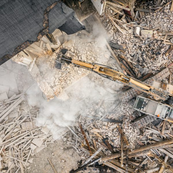 Yellow,Excavator,Destroys,Building.,Heavy,Duty,Machine,Is,Demolishing,A